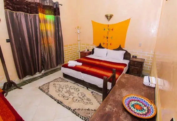 Double room with Moroccan textiles at Riad Lghiam in Rissani